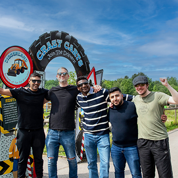 Corporate event visitors posing for a photograph at Diggerland